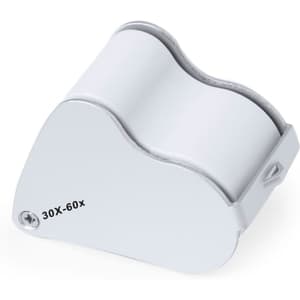 A white magnifier featuring 30X and 60X magnification levels, with a curved design and a metal attachment.
