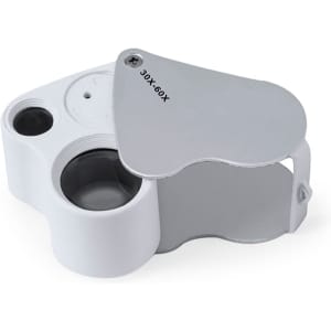 A white 30/60X magnifier with a hinged cover, featuring two lenses and a circular opening.