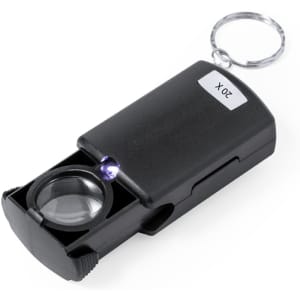 A black 20X magnifier keyring with a round lens and a small light, attached to a metal keyring.