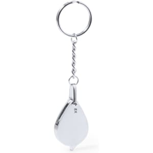 A silver 8X magnifier keyring with a teardrop shape and a metal chain attachment.