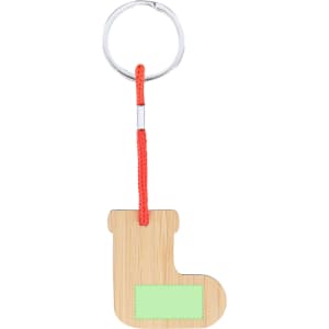 A bamboo keyring in the shape of a boot, featuring a light green label and an orange cord attachment.