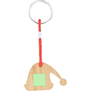 A bamboo keyring shaped like a Santa hat, featuring a red cord and a green square for customisation.