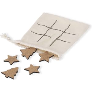 A drawstring bag containing a tic-tac-toe grid and wooden star and tree game pieces in natural colours.