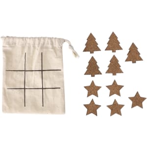 A drawstring bag with a tic-tac-toe design and ten cork game pieces shaped like trees and stars.