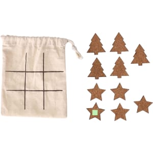 A cotton bag with a grid design, containing cork star and tree game pieces in brown.