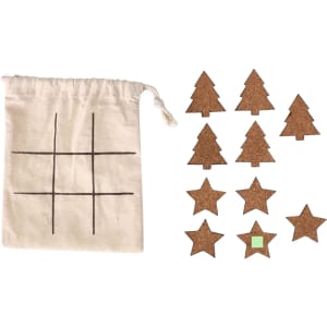 A cotton bag with a grid pattern and cork game pieces shaped like trees and stars in natural tones.