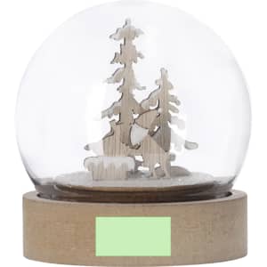 A snow globe with a wooden scene featuring trees and a woodland animal inside a glass dome on a wooden base.