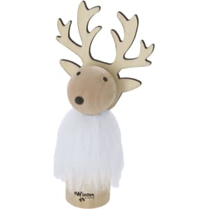 A wooden reindeer decoration featuring antlers and a white fluffy body. Includes a logo on the base.