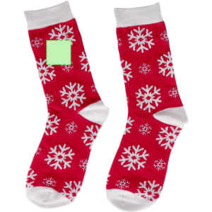 A pair of red socks featuring white snowflake patterns, with a grey cuff and a logo on one sock.