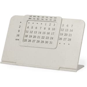 An off-white, tabletop perpetual calendar featuring numbers and days of the week. It has a simple, modern design.