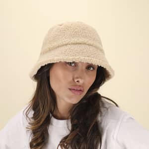 A beige bucket hat made from soft fleece material, featuring a simple design and a logo tag.