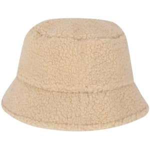 A beige beanie hat with a soft, fluffy texture and a bucket-style design. It features a logo.