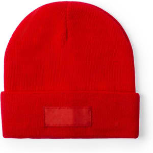 A red beanie hat featuring a simple fold and a blank space for branding.