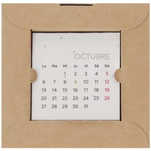 A desktop calendar in a brown cardboard holder featuring a grid layout for October dates in red and green.