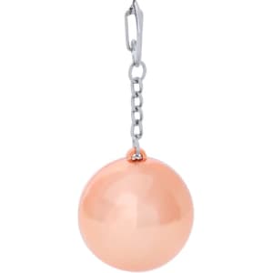 A peach-coloured lip balm in a spherical container, attached to a silver keyring with a chain.