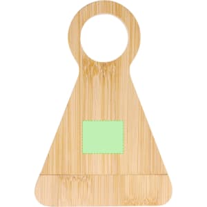 A bamboo bottle opener in a triangular shape with a circular hole at the top and a blank green patch.