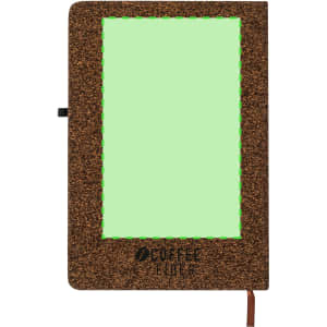 A brown notepad with a green textured cover, featuring a logo and an elastic closure.