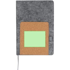 A grey notepad with a cork section, featuring a green insert area and a ribbon bookmark. It has branding on the cover.