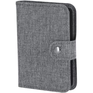 A grey, textured wireless charger with a clasped cover, designed for portable phone charging.