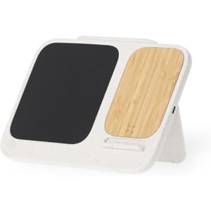 A wireless charger featuring a black writing surface and a bamboo panel, with a neutral-toned frame.