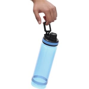 A drink bottle in blue with a black lid is held by a hand, featuring a clip for easy carrying.