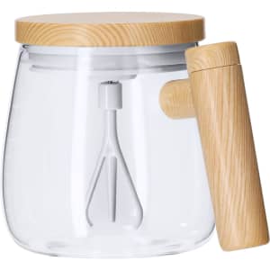A clear mixing mug with a wooden handle and lid, featuring a built-in mixing mechanism.