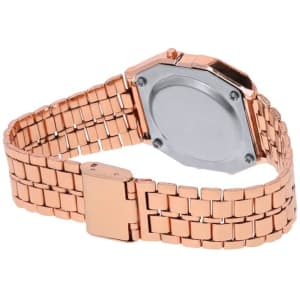 A rose gold watch with a metal band, showcasing an octagonal shape and a solid back.