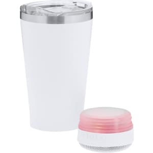 An insulated white travel mug with a clear lid and a small pink speaker beside it. Both items feature branding.
