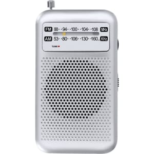 A silver portable radio with a tuning dial and an FM/AM frequency display, featuring a speaker grille.