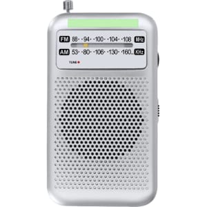 A small silver radio with a green tuning band, featuring FM and AM frequency dials and a speaker grille.