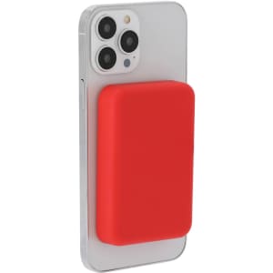 A red power bank attached to a smartphone, featuring a smooth surface and a logo on the side.