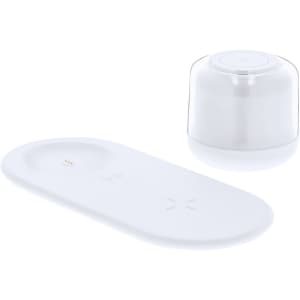 A white wireless charger with a circular spot for a device and a lamp dome on top. It includes a logo.
