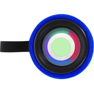 A round portable speaker covered in blue fabric with a circular light pattern in the centre. It has a strap for carrying.