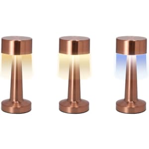 A set of three copper lamps with cylindrical bases and various light hues—yellow, white, and blue. Each lamp has a sleek design.