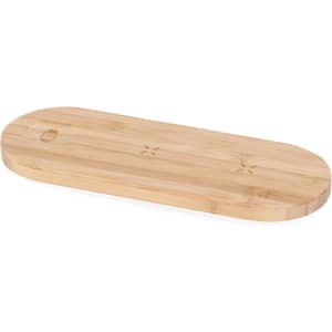 A bamboo wireless charger features a smooth, oval design and has a logo on one side.