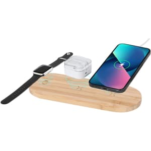 A wireless charger made of bamboo, featuring a smartphone, smartwatch, and wireless earbuds. It has a logo.