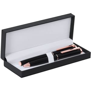 A black metal pen set with rose gold accents in a black gift box. The interior is grey.