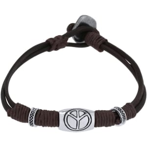A brown bracelet made of leather with a peace symbol and decorative bead accents, featuring a logo.