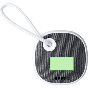 A compact black speaker with a textured surface, featuring a green area and a white strap for easy carrying.