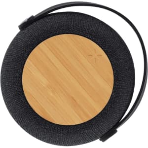 A round, black speaker with a bamboo centre and a carrying handle. It features a sleek, modern design.