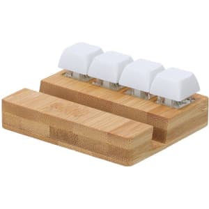 A bamboo phone stand features four white keyboard-like buttons and a flat base for stability.