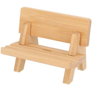A bamboo phone stand featuring a simple bench design with a natural finish and sturdy legs.