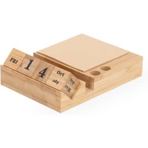 A wooden notepad calendar with removable blocks for days and months, featuring a minimalist design.