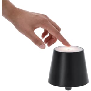 A black lamp with a conical shape, featuring a touch-sensitive top and a soft light.
