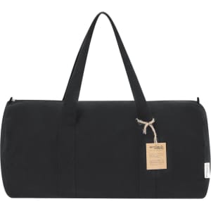 A black tote bag with two handles and a small tag, featuring a zippered closure.