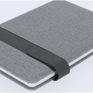 A grey notepad with a black elastic band, featuring a textured cover and a minimalist design.