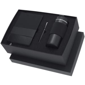 A drink bottle in a black box set, accompanied by a notebook and a pen, all featuring a sleek design.