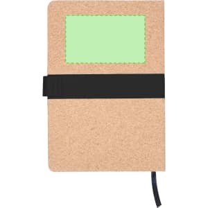 A brown notepad with a green patch and a black elastic band closure. It features a bookmark ribbon.