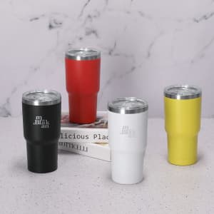 A collection of four insulated cups in red, black, white, and yellow, featuring a metallic lid and a logo.
