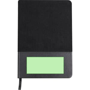 A black notepad with a textured cover and a blank green area on the front, featuring a ribbon bookmark.